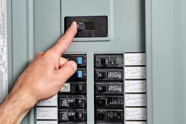 Man using Circuit Breaker in home